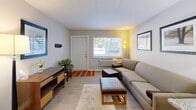 Located at 3946 Fishcreek Rd in Stow, Ohio, this well-designed one-bedroom, one-bathroom unit offers a functional and comfortable layout across a single floor. The living room greets you upon entry, featuring light-toned flooring, neutral walls, and a window that draws in natural light while offering a view of the outdoors. The space accommodates a seating area with ease and flows naturally into the rest of the unit. Adjacent to the living room, the compact kitchen is outfitted with rich dark-brown cabinetry, white countertops, a stainless steel sink, and black appliances, including a range and overhead ventilation — making efficient use of the available space. The bedroom is a cozy, private retreat with a window fitted with blinds for light control, light wood-style flooring, and a closet with bifold doors providing ample storage. The full bathroom features a dark-vanity cabinet with a white countertop sink, a large mirror with overhead lighting, and a shower-tub combination — all finished in a clean, neutral palette. Light wood-style flooring runs throughout the unit, lending a cohesive and modern feel to every room. This unit offers a smart, practical layout ideal for those seeking a streamlined living space in Stow, OH.