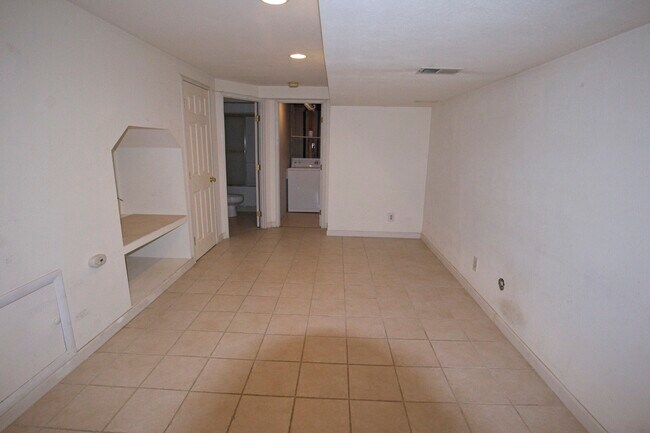 finished basement facing laundry area - 9545 W Coal Mine Ave