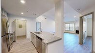 Located in Dunwoody, GA, this single-floor, three-bedroom, one-bathroom home offers a well-designed layout that maximizes both function and comfort. Light wood-style flooring runs throughout the space, creating a clean, cohesive aesthetic from room to room.

The open-concept kitchen is a standout feature, showcasing granite countertops, gray shaker-style cabinetry, a tile backsplash, and a full suite of stainless steel appliances including a refrigerator, range, and over-the-range microwave. A peninsula with a built-in sink and breakfast bar connects the kitchen seamlessly to the dining and living areas, making it ideal for everyday living and entertaining.

The living room is bright and welcoming, featuring a classic fireplace with a decorative surround, a ceiling fan with light fixture, and multiple windows that invite natural light. Access to an outdoor area is provided through sliding glass doors.

Each of the three bedrooms offers light flooring, ceiling fans, and generous closet access — four closets are distributed throughout the home. The spacious primary bedroom connects conveniently to the shared bathroom, which features a granite-topped vanity, gray cabinetry, and a large mirror. A dedicated laundry area rounds out this well-appointed home.