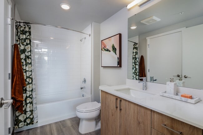 Finish Package II Bathroom with oak cabinetry, white quartz countertop, and hard surface flooring (Representative photo) - Avalon Tech Ridge