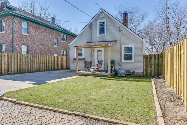 Backyard features fenced yard with covered porch, separate patio, 2 car garage and shed, along with plenty of space for parking - 7021 35th Avenue