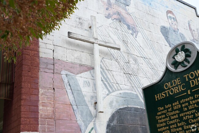 Detailed murals and art pieces enhance the charm of Olde Town Clinton.