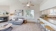 Located at 1107 Porter Street in Vallejo, CA, this single-floor, 2-bedroom, 1-bathroom home offers a well-designed layout with a clean, neutral palette throughout. The open-concept living and dining area is a standout feature, highlighted by vaulted ceilings, a tiled fireplace, and large sliding glass doors that fill the room with natural light and offer outdoor views. Soft carpeting underfoot adds warmth to this inviting space.

The kitchen is efficiently appointed with white cabinetry, solid countertops, a stainless steel sink, and a window overlooking greenery outside. Wood-style flooring runs through the kitchen, hallway, and bathroom, providing a cohesive contrast to the carpeted living and bedroom areas.

The primary bedroom is a comfortable retreat featuring a wide sliding-door closet and soft carpet. The second bedroom also offers carpeted flooring, a closet, and a window with natural light. Both rooms maintain the home's bright, airy feel.

The bathroom features a white vanity with ample cabinet storage and a well-lit mirror, accessed via the hallway. Additional conveniences include a dedicated laundry area and two closets for generous storage. This thoughtfully laid-out home balances function and comfort in a compact, efficient footprint.