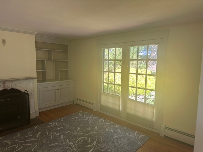 Right side of living room fireplace with patio door - 21 Usher Ter