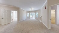 Located at 3663 Solano Ave in Napa, CA, this well-appointed 3-bedroom, 2-bathroom single-floor residence offers a thoughtfully designed layout with a warm, neutral palette throughout. The open living room is a standout space, featuring elegant crown molding, a ceiling fan, plush wall-to-wall carpeting, and a classic white-mantled fireplace that serves as a natural focal point. Large sliding glass doors invite abundant natural light and provide access to an outdoor area with greenery views.

The galley-style kitchen is equipped with stainless steel appliances, including a refrigerator, dishwasher, and range, complemented by rich dark wood cabinetry and granite-look countertops. Warm hardwood-style flooring grounds the kitchen and flows into the adjoining areas.

The primary bedroom is generously sized and includes access to a spacious walk-in closet outfitted with extensive wire shelving and hanging systems on all sides. Both bathrooms feature tiled shower-tub combinations, dark wood vanities, and light stone countertops, maintaining a consistent and clean aesthetic.

The two additional bedrooms are carpeted and well-lit, with one featuring a window overlooking lush outdoor greenery. A connecting hallway ties the layout together efficiently, making this Napa residence both functional and comfortable.