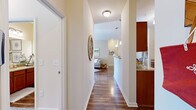 Located in Spring Hill, Tennessee, this single-floor, 2-bedroom, 2-bathroom residence offers a thoughtfully designed layout with stylish finishes throughout. Rich hardwood-style flooring flows through the entryway, kitchen, living areas, and bathrooms, creating a warm and cohesive aesthetic.

The open-concept kitchen is well-equipped with warm wood cabinetry, granite countertops, stainless steel appliances, a double sink, and a breakfast bar peninsula with elegant pendant lighting overhead. It connects seamlessly to the dining area and living room, which benefits from large windows that fill the space with natural light.

The primary bedroom is generously sized, featuring plush carpeting, a ceiling fan, and ample closet space. Large windows provide views of the surrounding neighborhood and allow sunlight to brighten the room. The second bedroom is equally comfortable, sharing the same carpeted, light-filled character.

Both bathrooms are finished with granite-topped wood vanities and tiled tub-shower combinations with hardwood-style flooring. A dedicated laundry room with wire shelving and washer hookups adds everyday convenience. Two closets provide practical storage throughout the home. The overall ambiance is warm, bright, and inviting — ideal for comfortable single-floor living.