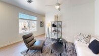 Located at 630 N Kelly Ave in Oklahoma City, this thoughtfully designed one-bedroom, one-bathroom residence offers a clean, modern aesthetic across a single floor. The open-concept kitchen and living area form the heart of the unit, where light wood-tone flooring, white walls, and ceiling fans create a bright, airy atmosphere. Large windows invite generous natural light throughout, with views of the surrounding neighborhood.

The kitchen is outfitted with sleek white cabinetry extending to the ceiling, light countertops, and a full suite of stainless steel appliances including a range, built-in microwave, dishwasher, and refrigerator — all finished with brushed silver hardware for a cohesive, contemporary look.

The living area offers comfortable proportions with ample room for seating and accent furnishings, and benefits from a large picture window that further brightens the space.

The bedroom is a calm retreat featuring a walk-in closet with built-in shelving, a ceiling fan, and a window with outdoor views. Light flooring and neutral walls keep the room feeling open and restful.

The bathroom features light wood-look flooring, a white vanity with clean countertops, and a bathtub, maintaining the unit's consistent, modern design language throughout.