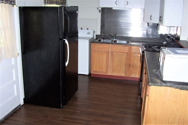 Building Photo - Fenced-in Yard + Washer & Dryer Included +...