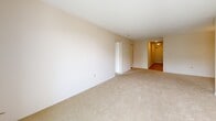 Located at 310 Dundas Street in downtown London, Ontario, this 2-bedroom, 2-bathroom unit offers a thoughtfully organized single-floor layout with a comfortable sense of space throughout. The entry hallway, finished with smooth hardwood-style flooring, features a built-in sliding-door closet and leads seamlessly into the main living areas. The living room and dining room flow together in an open arrangement, finished with plush neutral carpeting and anchored by a pendant light fixture in the dining area. The kitchen is well-equipped with white cabinetry, stainless steel appliances including a refrigerator and range, and durable hardwood-style flooring, with convenient access to the laundry area nearby. Both bedrooms are generously sized, carpeted for comfort, and receive natural light through large windows with views of the surrounding cityscape. The primary bedroom is notably spacious, offering ample room for furnishings. The two bathrooms are clean and functional — one features a vanity with a large mirror and modern light fixture, while the other includes a full tiled tub-shower combination. A private balcony completes this well-rounded unit, ideal for those seeking comfortable urban living in the heart of London, ON.