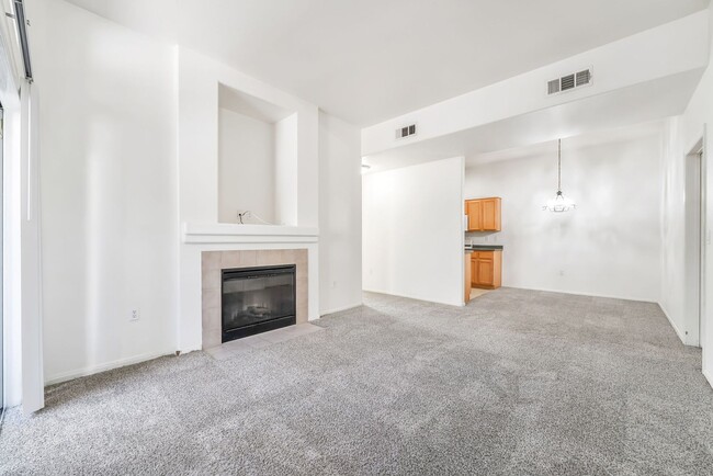 Building Photo - Stylish First-Floor Condo with 10’ Ceilings, Fireplace & Resort-Style Amenities!