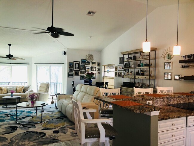 Building Photo - Experience the Gated Waterfront Community,...