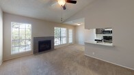 Located at 3009 Ira Young Dr in Temple, Texas, this single-story residence offers a thoughtfully designed layout that balances comfort and functionality. The entryway welcomes you with warm wood-look flooring that extends through the main corridors, setting a clean and modern tone throughout.

The spacious living room serves as the heart of the home, highlighted by a tile-surround fireplace, abundant natural light from multiple windows with blinds, and a ceiling fan overhead. The open layout connects seamlessly to the kitchen, which features a galley-style design with dark cabinetry, granite-look countertops, white subway tile backsplash, stainless steel appliances including a refrigerator, microwave, and range, and wood-look flooring underfoot.

The bedrooms are carpeted and generously sized, offering a soft, quiet retreat. One bedroom includes a large window that fills the room with natural light and provides access to a walk-in closet. The bathroom is finished with dark wood-tone cabinetry, granite countertops, a tall storage cabinet, and a shower-tub combo with tiled walls. A textured ceiling is consistent throughout the home, adding a classic residential character to each room.