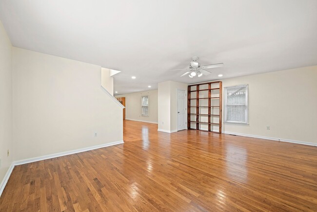 Large living room with a cozy bookcase for added charm - 247 Farrington Ave SE