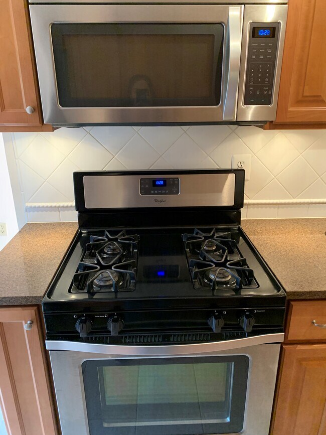 Brand new Whirlpool gas stove and microwave. - 3366 Woodburn Rd