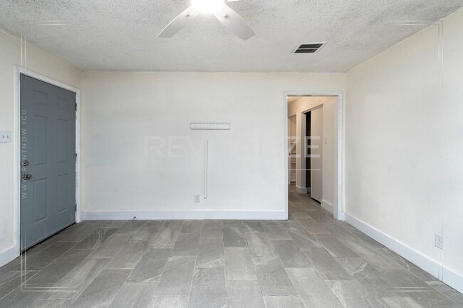 Building Photo - 3 BR 2 BA Home with Fenced Yard & Carport