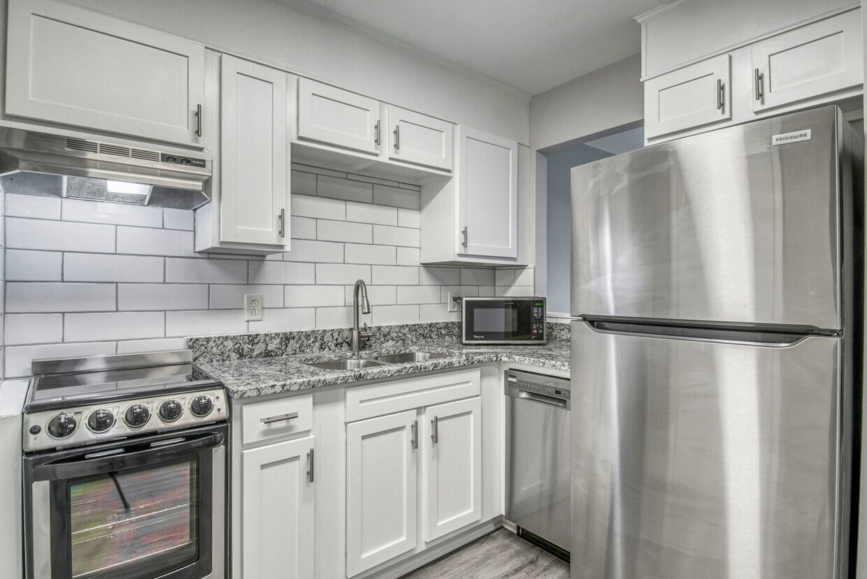 Cocina Premier de 1 dormitorio - Village Green Apartment Homes