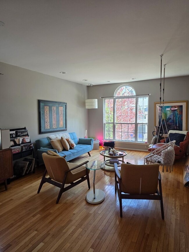 Building Photo - Stunning 3–4 Bedroom Townhome in Private Community | Garage + EV Charger | Deck with Tree Views