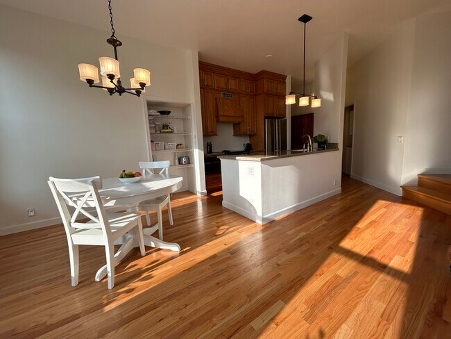 Dining space adjacent to full kitchen. - 165 Western Ave N