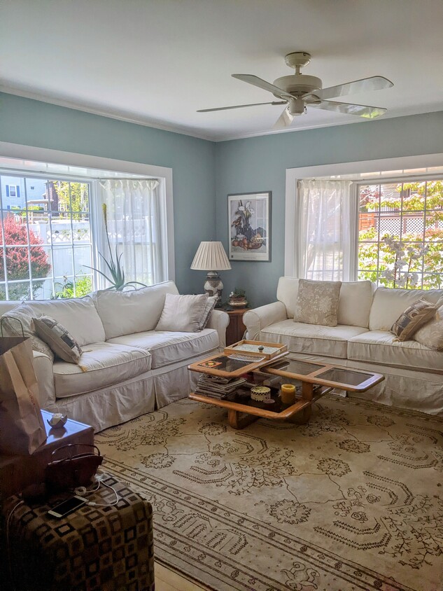 Sunny living room with large bay windows - 63 Essex St