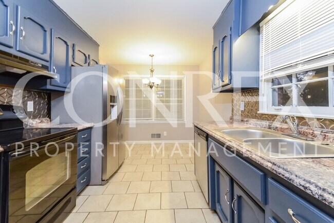 Building Photo - Massive 5 Bedroom Brick Home Available!