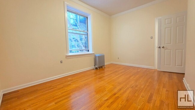 Building Photo - Bright 4th-Floor 1-Bed with Triple-Window Living Room in Greenwich Village