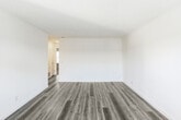 Located at 200 Hollis Ave in Campbell, California, this 2-bedroom, 1-bathroom single-story residence offers a well-organized layout with a clean, modern aesthetic. Light-toned luxury vinyl plank flooring runs throughout the main living areas, complementing the bright, neutral walls and creating a cohesive, airy feel.

The kitchen is a standout feature, outfitted with white shaker-style cabinetry, light countertops, a stainless steel sink, and a full suite of stainless steel appliances including a range, dishwasher, and refrigerator. Recessed lighting and wainscoting detailing add a polished touch to this functional space.

The living room receives natural light through a large window with horizontal blinds and includes a wall-mounted HVAC unit. The two bedrooms are carpeted and generously sized, with the primary bedroom offering notable square footage, dual windows for natural light, and a reach-in closet with built-in shelving. The secondary bedroom features a ceiling fan and wainscoting.

The bathroom is finished in crisp white with a vanity featuring ample storage, a full tub/shower combination, and matching LVP flooring. Textured ceilings are present throughout. The overall design is bright and move-in ready, offering a comfortable living environment in a convenient Campbell location.