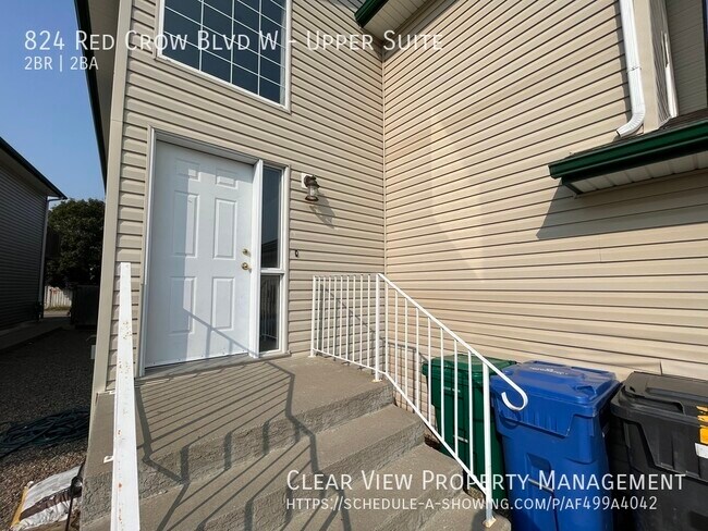 Photo du bâtiment - Bright & beautiful 2-bd, 2-bth main-level suite with garage, AC and UTILITIES included! ??Showing...