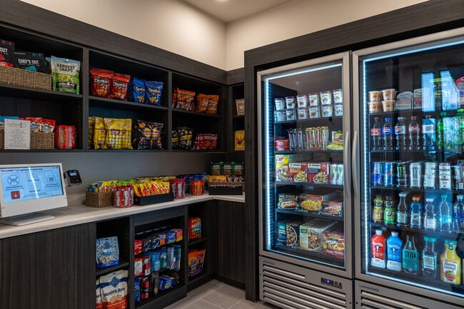 Explore the convenient snack and refreshment area in this luxury apartment community. - Livano Springdale