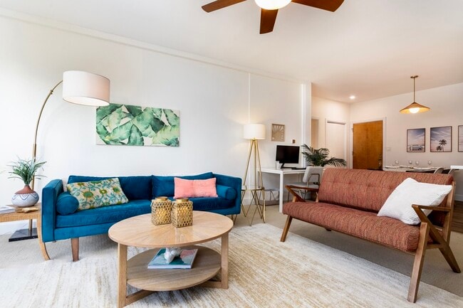 Modern coastal living room with West Elm seating and abundant natural lightt - 2221 Ocean Ave