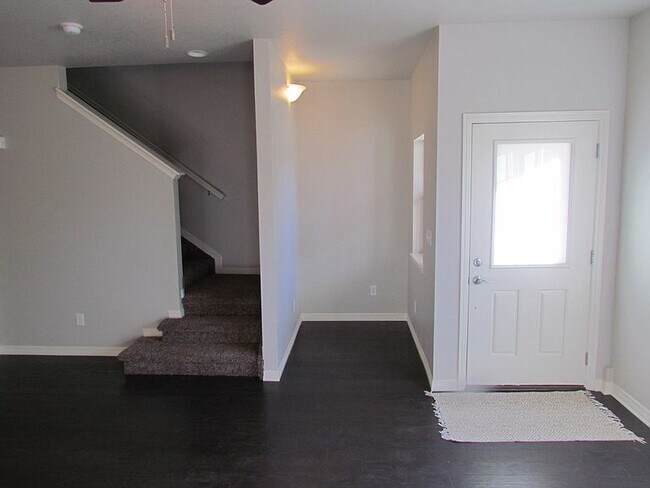 Small office nook on main floor. Carpeted stairs and upper level. - 3800 Manhattan Ave