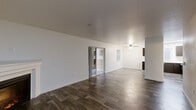 Located at 2501 NE 138th Ave in Vancouver, WA, this single-floor, three-bedroom, two-bathroom home offers a well-designed layout across a comfortable footprint. Wood-look plank flooring runs throughout the main living areas, lending warmth and a cohesive aesthetic to the space.

The living room serves as the heart of the home, featuring a classic fireplace with a white mantel and sliding glass doors that open directly to a private patio, filling the room with natural light. A ceiling fan overhead adds to the comfort of the adjacent dining area, which flows seamlessly into the kitchen. The kitchen is appointed with dark espresso cabinetry, white countertops, stainless steel appliances including a dishwasher, and a ceiling fan — offering both style and functionality.

The three bedrooms are carpeted for comfort, with several featuring ample closet space including sliding and hinged closet doors. The primary bedroom is a well-proportioned retreat. Both bathrooms mirror each other in design, each featuring a single-sink vanity with dark cabinetry, white countertops, a large mirror, and a tub/shower combination with tile surround and wood-look flooring.

Additional highlights include a dedicated laundry area, a pantry, and abundant closet storage throughout. The entrance and hallway connect all spaces efficiently, making this a practical and attractive home.