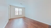 This contemporary 760 square foot apartment in Nashville offers a thoughtful blend of style and functionality. The open-concept living area seamlessly integrates the kitchen and living room, creating a spacious feel. The kitchen boasts rich wood cabinetry, stainless steel appliances, and a striking granite countertop with a breakfast bar, perfect for casual dining or entertaining.

The generous 200 square foot bedroom provides ample space and is complemented by a well-appointed bathroom featuring a tub-shower combination and a sleek vanity. Hardwood floors run throughout the main living areas, adding warmth and elegance to the space.

Large windows in the living area and bedroom allow for abundant natural light, while offering views of the surrounding neighborhood. A private balcony extends the living space outdoors, providing a perfect spot for relaxation or al fresco dining.

The apartment's neutral color palette and modern fixtures create a contemporary ambiance, while the thoughtful layout maximizes the use of space. With its combination of style, comfort, and location at 1055 Pine Street in Nashville, this apartment offers an ideal urban living experience.