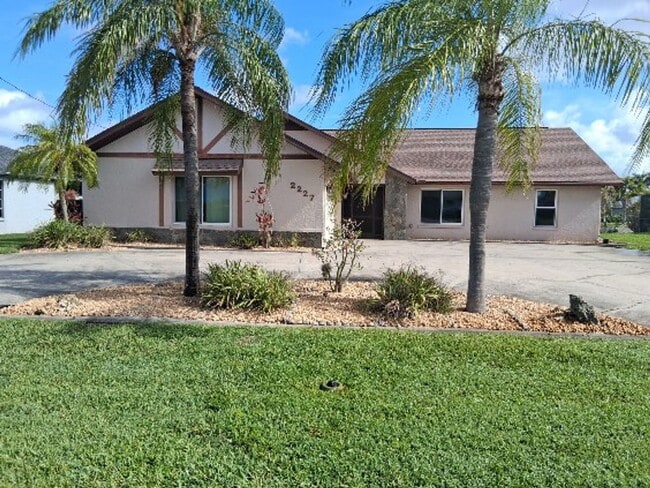 Building Photo - COMING SOON: Spacious Gulf Access 3 BR / 3 BA Home With a Large Screened Lanai for Entertaining &...