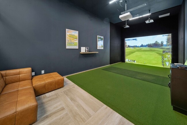 Catch 18 holes without leaving the comfort of home at the Shoreline's state-of-the-art golf simulator. - SoLe Mia Rentals