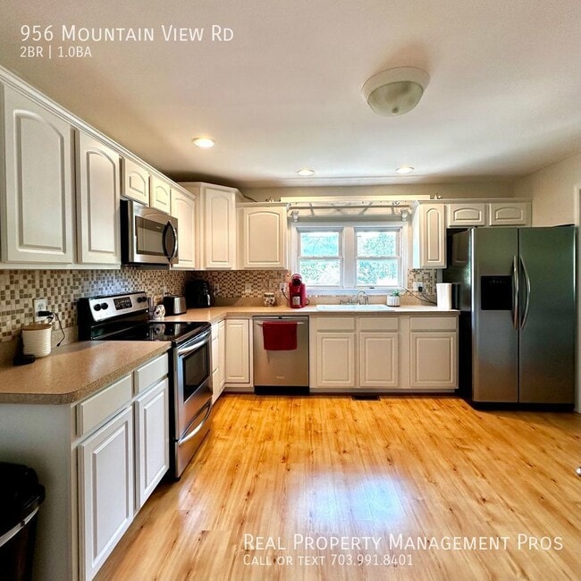 Building Photo - Renovated Bungalow on Private Lot with Mod...
