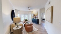 Located in Haltom City, TX, this well-appointed single-story home offers an efficient and stylish layout across a comfortable footprint. Light wood-look flooring flows throughout, tying together each space with a warm, cohesive aesthetic.

The open-concept kitchen and living area serves as the heart of the home. The kitchen features two-tone cabinetry in gray and natural wood tones, white quartz countertops, stainless steel appliances, a subway tile backsplash, and a matte black faucet. This space opens seamlessly into a bright living and dining area bathed in natural light from large windows and glass doors, with crown molding and a ceiling fan adding architectural character.

The spacious primary bedroom is a serene retreat, featuring a ceiling fan, natural light from a window, and ample room for furnishings. Two closets provide generous storage. Three well-appointed bathrooms serve the home, including one with a tub-shower combination and light, neutral finishes.

A dedicated office with a centered window flanked by wall art offers a quiet, functional workspace. A connecting hallway with recessed lighting links the rooms smoothly. With neutral walls throughout and an abundance of natural light, this home strikes a balance between modern design and everyday comfort.