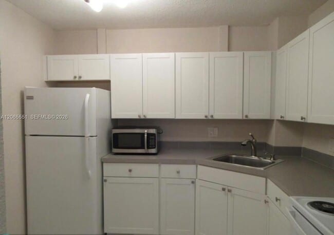 Building Photo - 10751 Royal Palm Blvd