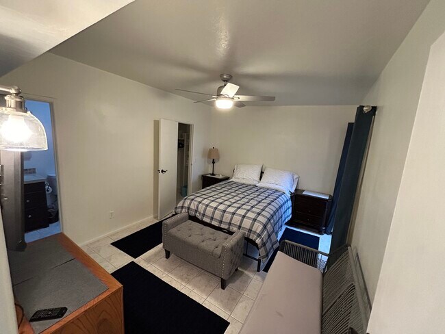 Master bedroom hasa Queen bed TV, and walk in closet. There is an exit to the back yard. - 2552 N Sahuara Ave