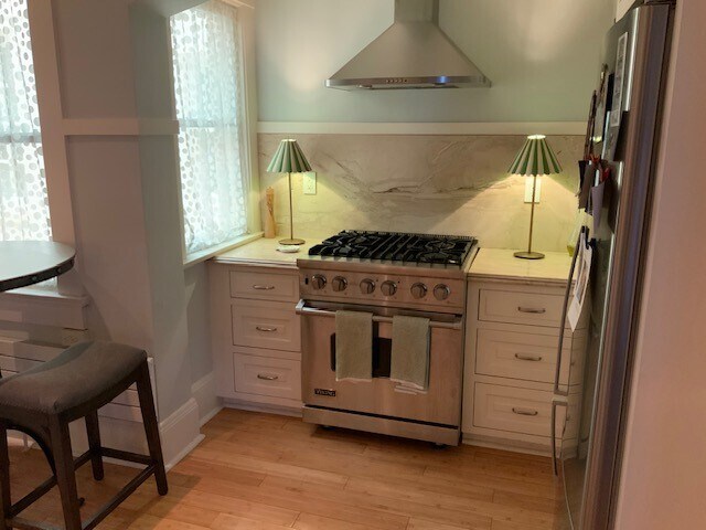 Stainless steel gas range and hood - 2205 N Farwell Ave