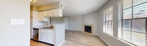 This well-designed 780 square foot apartment in Daytona Beach, FL offers a harmonious blend of comfort and functionality. The open-concept living area seamlessly integrates the kitchen and living room, creating a spacious feel enhanced by large windows that flood the space with natural light. The kitchen boasts white cabinetry, granite countertops, and stainless steel appliances, providing both style and practicality.

The apartment features two bedrooms, including a generous 190 square foot primary bedroom, both equipped with plush carpeting and modern ceiling fans. Ample closet space ensures organized living. Two full bathrooms with contemporary fixtures and wood-look flooring add convenience and style.

Throughout the apartment, neutral tones and wood-look flooring create a cohesive, modern aesthetic. The dedicated laundry area with full-sized appliances adds to the unit's practicality. Energy-efficient features like ceiling fans and window treatments contribute to comfortable living.

This single-story apartment combines the ease of apartment living with thoughtful design elements, making it an ideal home for those seeking a contemporary, low-maintenance lifestyle in the heart of Daytona Beach.
