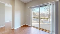 This well-laid-out 2-bedroom, 1-bathroom unit at 700 King St W offers a practical and comfortable single-floor living experience. Warm hardwood flooring runs throughout the main living areas and bedrooms, creating a cohesive and inviting atmosphere, while neutral grey walls provide a clean, versatile backdrop throughout.

The open living and dining area is bright and functional, featuring recessed pot lighting and a sliding glass door that leads directly to a private patio, offering outdoor views and filling the space with natural light. The kitchen is efficiently designed with rich dark-brown cabinetry, granite-style countertops, a stainless undermount sink, and black appliances including an electric range and refrigerator, all set on light ceramic tile flooring.

Both bedrooms are comfortably sized, with the primary bedroom featuring a large mirrored sliding door closet. The second bedroom also includes a sliding door closet and benefits from a large window that draws in ample natural light and outdoor views. The bathroom is finished with a clean white tile surround and a full soaker bathtub. Additional storage is provided through two closets, and a dedicated entrance area completes this practical and well-organized home.