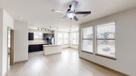 Located in Katy, TX, this single-story home offers a thoughtfully designed layout with two bedrooms and two full bathrooms. The open-concept living, dining, and kitchen area forms the heart of the home, featuring light wood-style flooring, a ceiling fan, and an abundance of natural light from multiple windows with blinds. The kitchen is well-equipped with dark espresso cabinetry, light granite-style countertops, a center island, track lighting, and stainless appliances, all flowing seamlessly into the living and dining spaces.

The primary bedroom is generously sized, complete with a ceiling fan, walk-in closet, and direct access to a well-appointed en-suite bathroom. The primary bath features a dual-sink vanity with dark cabinetry, a soaking tub with tile surround, a separate glass-enclosed shower, and a walk-in closet. The second bedroom benefits from natural light through a large window and light flooring throughout. Hallways connect the private areas of the home, lined with louvered closet doors for additional storage. A dedicated laundry room and multiple closets add practical convenience. The clean, neutral color palette and consistent flooring create a cohesive and inviting atmosphere throughout.