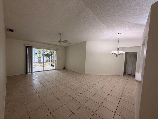 Building Photo - Centrally located 3/2 with 2 car garage. Pet friendly with fenced in backyard. Lawncare included.