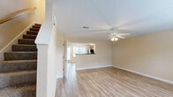 Located at 2015 Empress Dr in Murfreesboro, TN, this two-story home offers a practical and comfortable layout across two well-proportioned floors. The main level houses the kitchen and living room, with the kitchen featuring warm oak cabinetry, dark countertops, black appliances including a refrigerator, range, and built-in microwave, and durable wood-look vinyl flooring. The living room is bright and airy, with a ceiling fan, wood-look flooring, and a large window that invites natural light and outdoor views. A set of double doors provides convenient closet storage, and an electrical panel is discreetly integrated into the space.

Upstairs, the two bedrooms are carpeted for comfort, each equipped with ceiling fans and windows overlooking the surroundings. The spacious primary bedroom includes a walk-in closet with wire shelving for ample storage and direct access to one of the three bathrooms. The additional bedrooms benefit from their own natural light. All three bathrooms are finished with wood-look flooring, vanities with wooden cabinetry, and tub/shower combinations. A concrete patio area at the rear of the home, along with a central HVAC unit, completes this well-appointed residence.