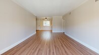 Located at 315 E Broadway in San Gabriel, CA, this well-maintained 2-bedroom, 2-bathroom residence offers a thoughtfully designed single-level layout. Wood-look laminate flooring flows consistently throughout, complemented by crown molding and textured ceilings that add architectural character to each room.

The open-concept living and dining area is a highlight of the home, anchored by a decorative corner fireplace with a striking textured surround. A sliding glass door brings in abundant natural light and provides outdoor access. Ceiling fans are found in multiple rooms, enhancing comfort and airflow throughout.

The kitchen is efficiently designed with rich dark wood cabinetry, granite-style countertops, a double basin sink, and stainless steel appliances. It opens toward the living and dining spaces, creating a connected, functional flow.

Both bedrooms are comfortably sized, with the spacious primary bedroom offering ample room. Each bedroom features ceiling fans, closet access, and windows that invite natural light. The two bathrooms are well-appointed with white cabinetry, granite countertops, framed mirrors, and wood-look flooring. Six closets throughout the unit provide generous storage. The overall ambiance is clean, bright, and move-in ready.