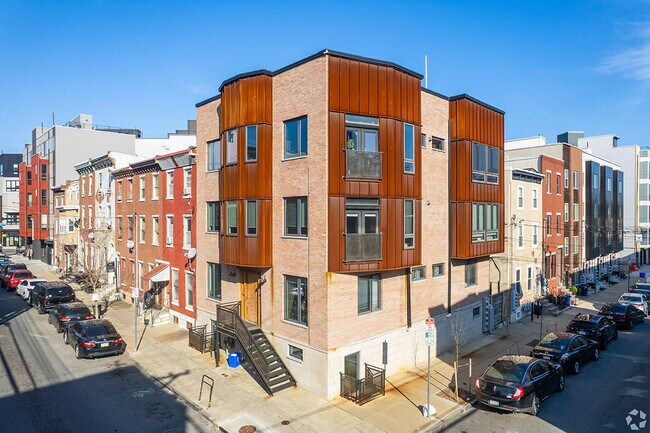 Residential streets feature a mix of older rowhomes and modern apartment communities.