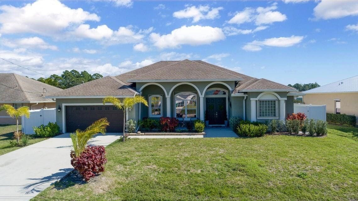 Photo - 6455 Northwest Fagan Street, Port St. Lucie, FL 34986 - 4 BR 3 BA Single-Family Home