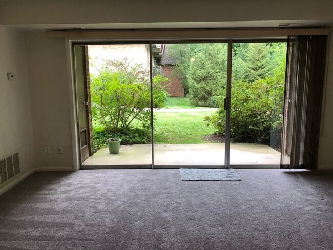 Large Living Room with Floor to Ceiling Glass doors, window treatments and walk out Patio - 11613 Vantage Hill Rd