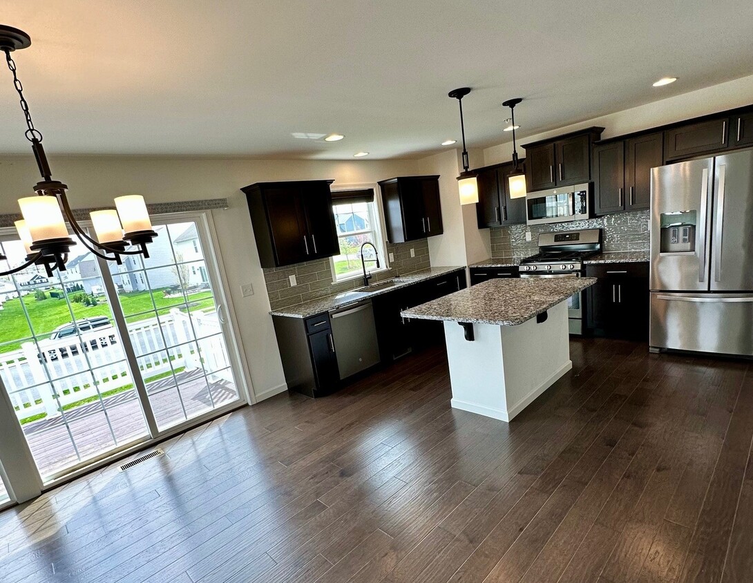 Dining Room/Kitchen looking out the 3-panel slider to deck - 1618 Haralson Dr