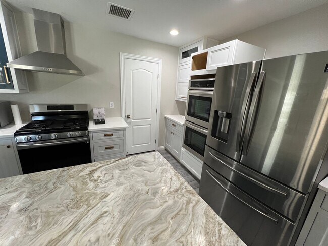 Building Photo - COMING SOON !!   GORGEOUS GATED RENOVATED ...